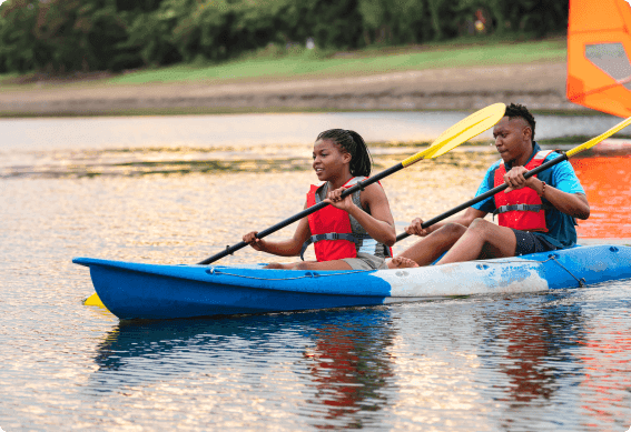 a couple of people in a canoe