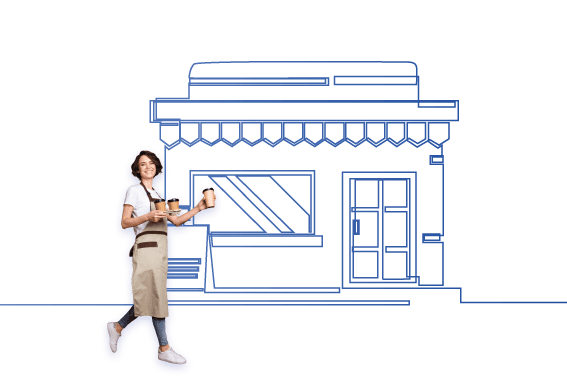 barista holding coffee in front of store