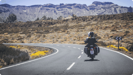 a person riding a motorcycle on a road