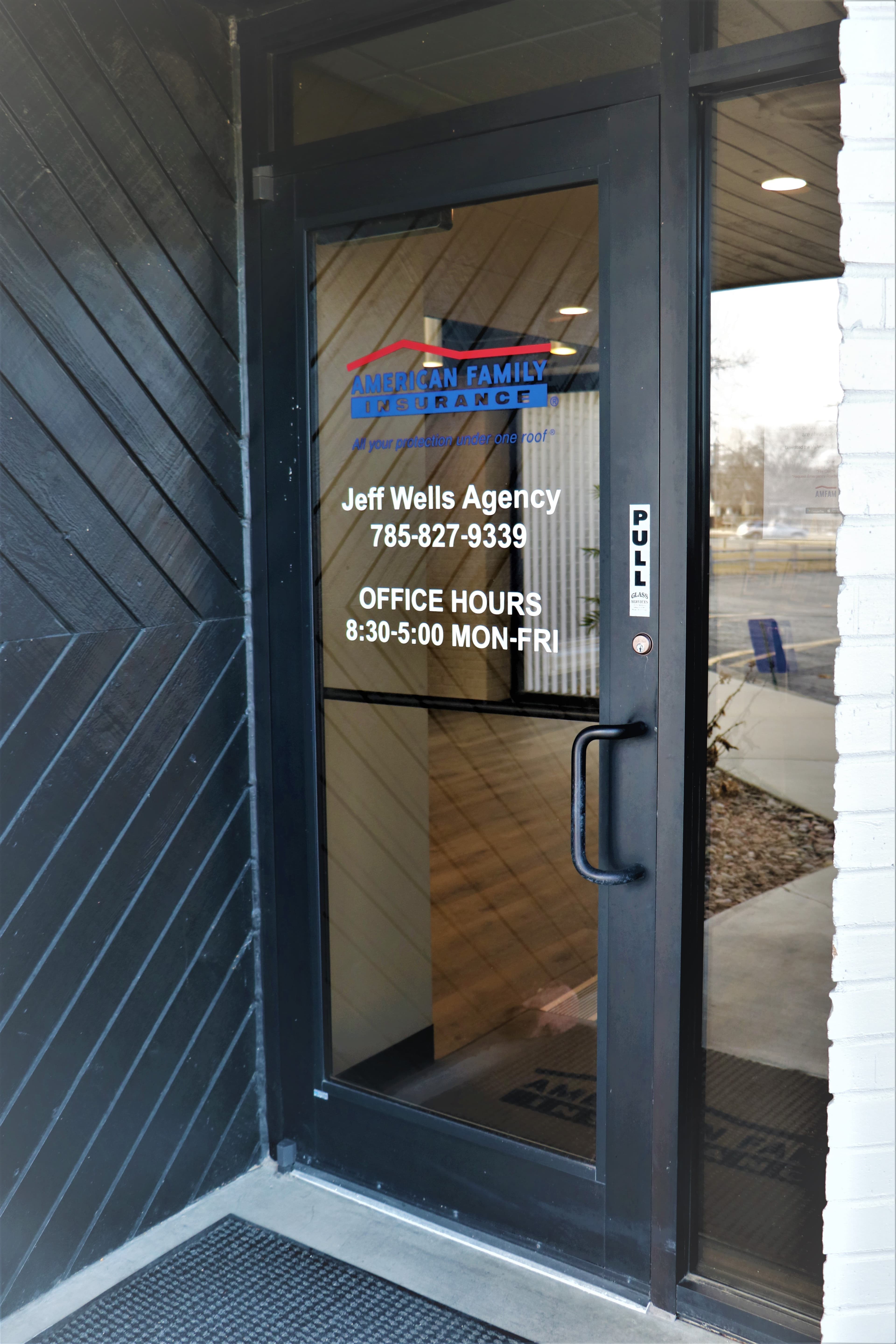 a glass door with a sign on it