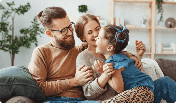 a man and woman holding a baby